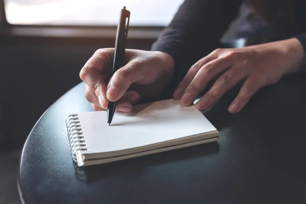 Closeup Image Woman Hands Writing White Blank Notebook Table — Stock Photo, Image