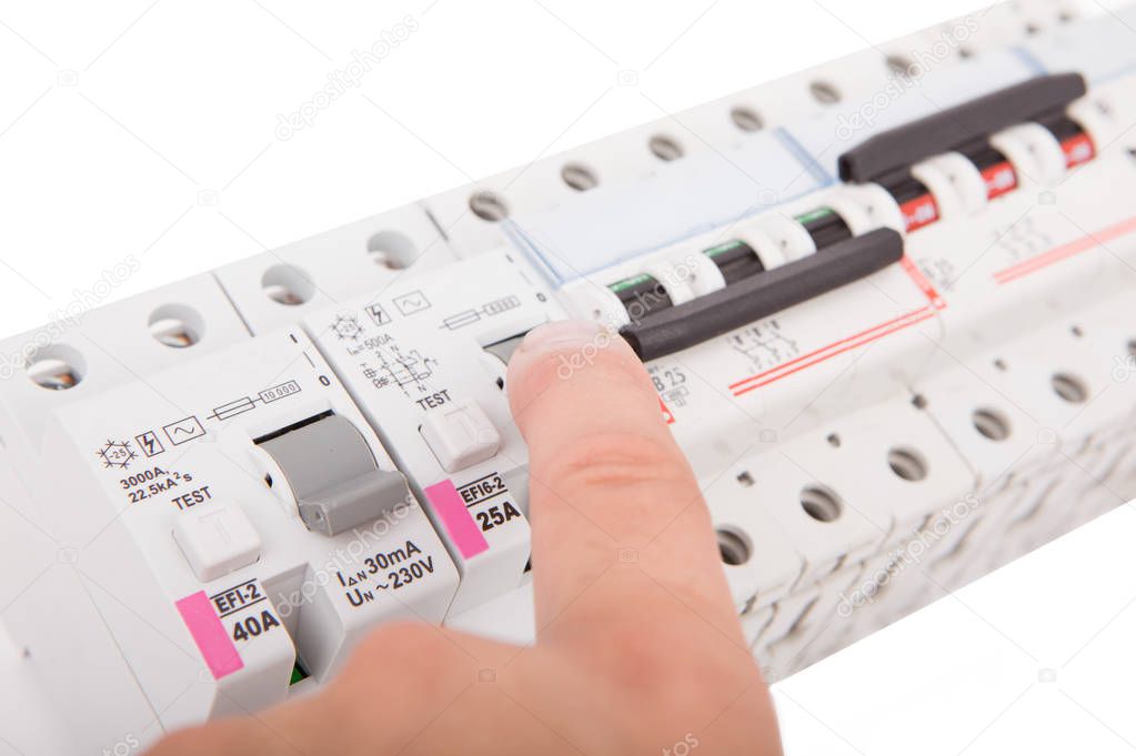 Electric fuses. Man turning off the fusebox.