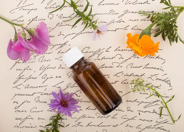 Natural remedies - Fresh Herbs. Natural Medicine, aromatherapy - bottle.