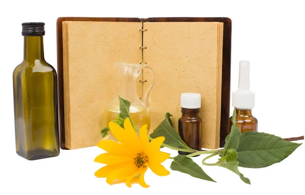 The ancient natural medicine, herbs, medicines and old empty open notebook.