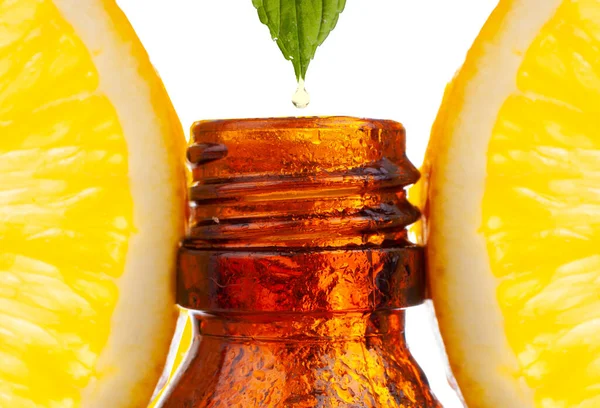 Dripping Citrus Essential Oil Bottle White Background — Stock Photo, Image