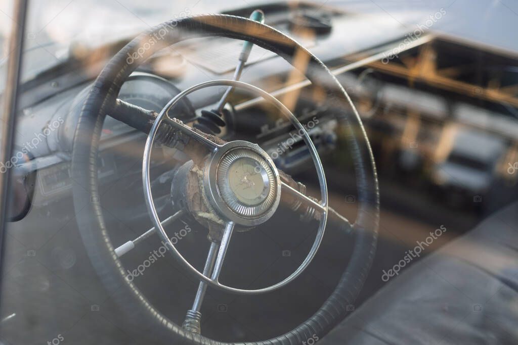 Wroclaw, Poland - August 28 2025: Steering wheel with deer emblem inside vintage GAZ Volga