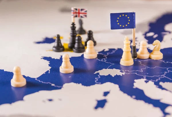 Chess pieces and flags on an European map focused on white EU king. Brexit negociations and strategy concept between European Union and United Kingdom.