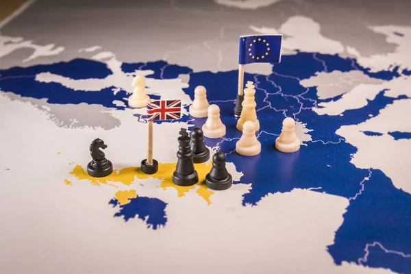 Chess pieces and flags on an European map. Brexit negociations and strategy concept between European Union and United Kingdom.
