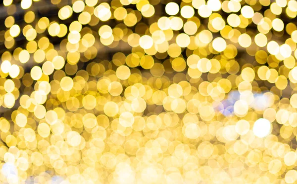 Mooie gouden wazig bokeh achtergrond met kopie ruimte. Glitter geel licht vlekken intreepupil — Stockfoto