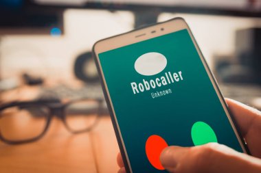 Smartphone showing a call from a robocaller on screen clipart