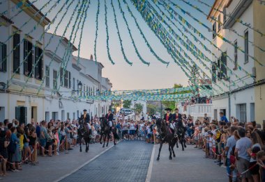Riders on his horse during a horse celebrations in the Spanish island of Minorca clipart