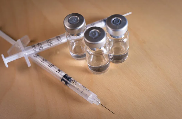 Close up of a medicine vials and syringe — Stock Photo, Image