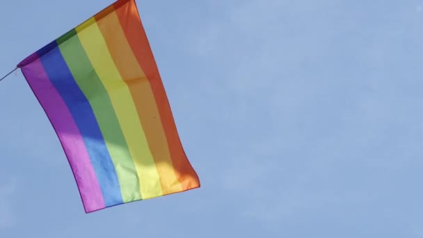 Gay pride rainbow flag blowing in the wind, copyspace available — Stock Video