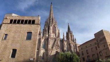 Hyperlapse revealing intricate Gothic architecture of Barcelona Cathedral standing majestically within historic Barri Gotic. Capturing ornate stone facade
