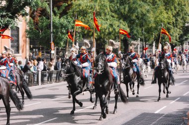 Madrid, Spain. October 12, 2014, Members of the Royal Escort Squadron of the Spanish Royal Guard riding their horses during a parade in Madrid