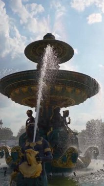 Water jets spraying from Fontaine des Mers, a monumental fountain on Place de la Concorde in Paris, France