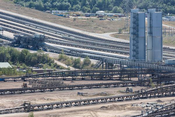 Open pit mine with conveyor belts transporting coal to powerplant