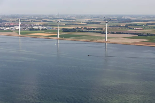 Aerial view Dutch agricultural landscape with wind turbines along coast — Stock Photo, Image