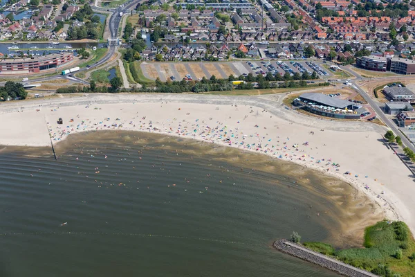 Aerial view beach Dutch village Lemmer with swimming people — Stock Photo, Image