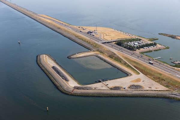 Aerial view Dutch dike Afsluitdijk between IJsselmeer and Wadden Sea