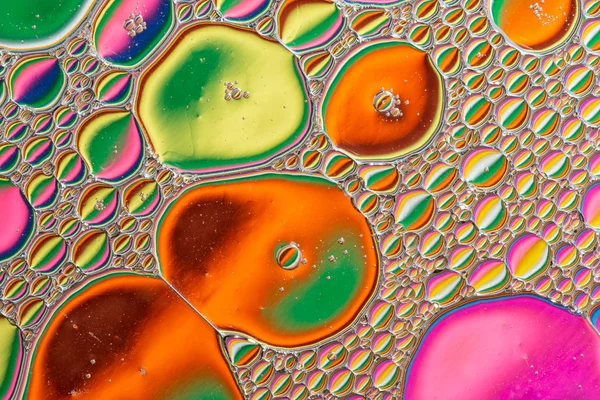 Fondo abstracto de gotas de aceite de colores en el agua —  Fotos de Stock