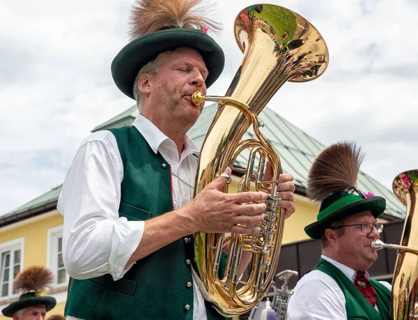 Festival with parade of fanfare and people in traditonal costumes — Stock Photo, Image