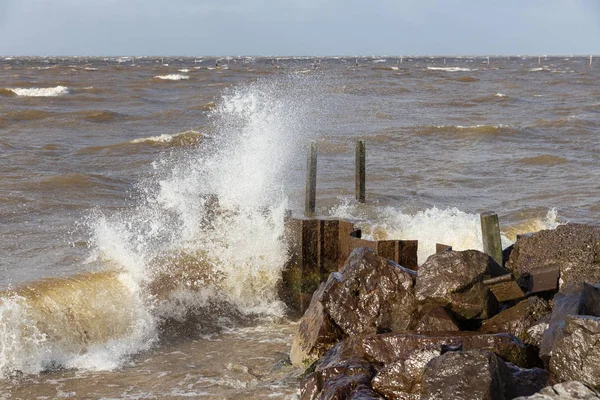 Dutch breakwater with breaking wave in heavy storm — Stock Photo, Image