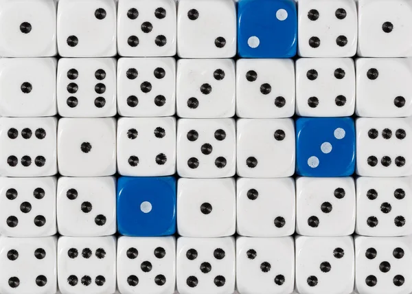 Background of random ordered white dices with three blue cubes — Stock Photo, Image