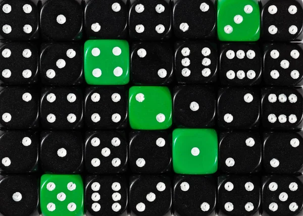 Background of random ordered black dices with five green cubes — Stock Photo, Image