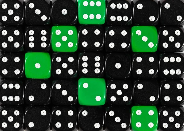 Background of random ordered black dices with six green cubes — Stock Photo, Image