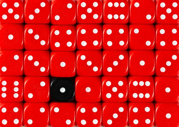 Background of random ordered red dices with one black cube — Stock Photo, Image