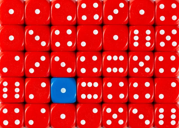 Background of random ordered red dices with one blue cube — Stock Photo, Image