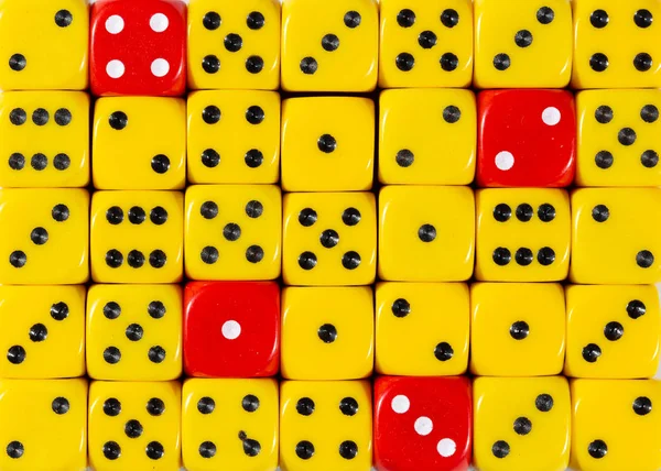 Background of random ordered yellow dices with four red cubes — Stock Photo, Image