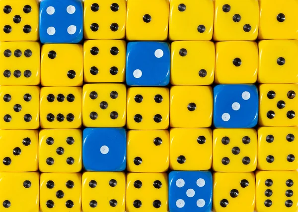 Background of random ordered yellow dices with five blue cubes — Stock Photo, Image