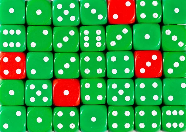 Background of random ordered green dices with four red cubes — Stock Photo, Image