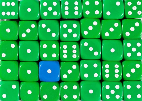 Background of random ordered green dices with one blue cube — Stock Photo, Image