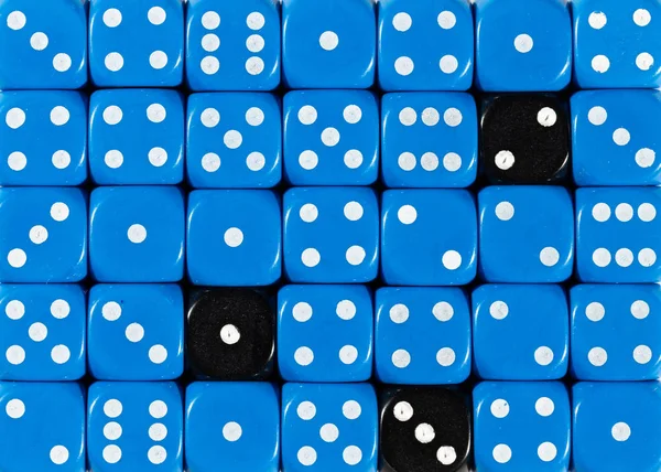 Background of random ordered blue dices with three black cubes — Stock Photo, Image