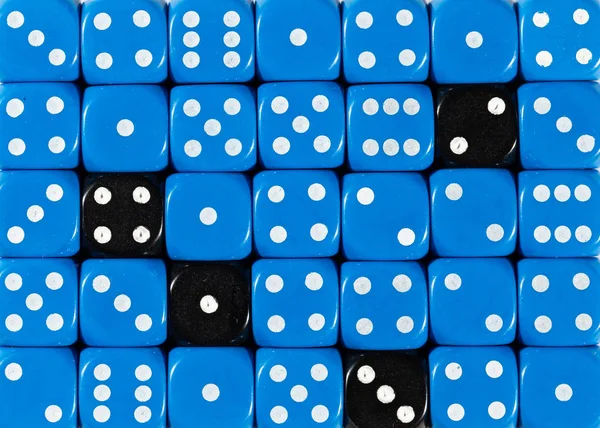 Background of random ordered blue dices with four black cubes — Stock Photo, Image