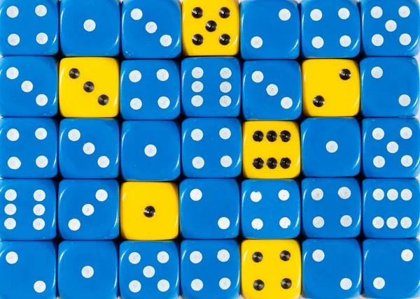 Background of random ordered blue dices with six yellow cubes — Stock Photo, Image