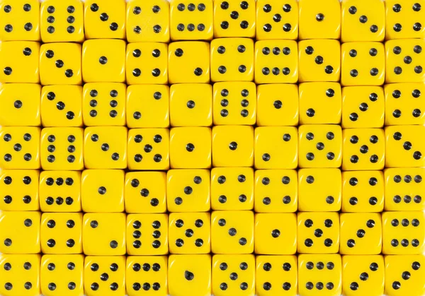 Background pattern of 70 yellow dices, random ordered — Stock Photo, Image