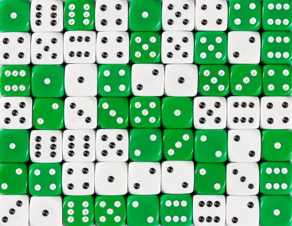 Background of 70 random ordered white and green dices — Stock Photo, Image