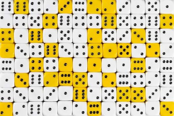 Background patteren of random ordered white and yellow dices