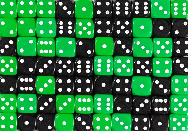 Background of 70 random ordered black and green dices — Stock Photo, Image