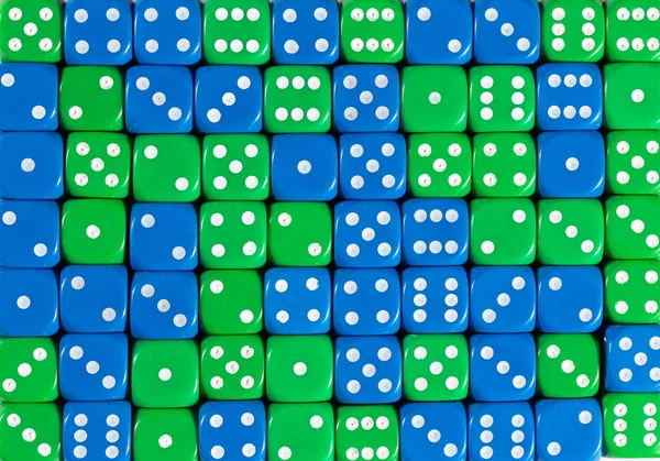 Background of 70 random ordered blue and green dices — Stock Photo, Image