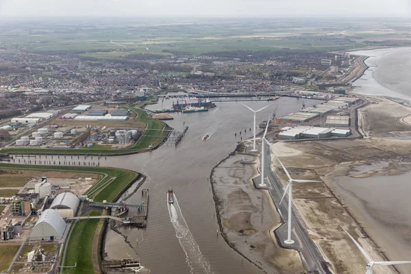 Aerial view Dutch harbor Delfzijl with wind turbines and factories — Stock Photo, Image