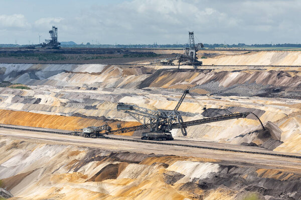 Digging machines busy with deposit soil in Hambach mine Germany
