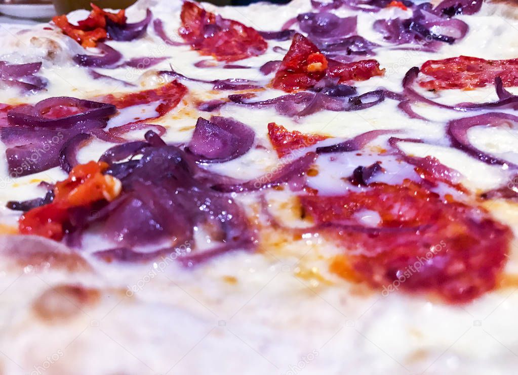 tasty delicious round italian traditional pizza with fresh natural ingredients with onions and spicy peppers