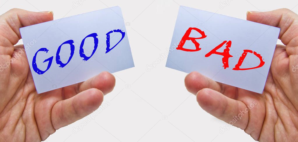 good and bad choice signs in man hands on a white background. for business and education concepts 