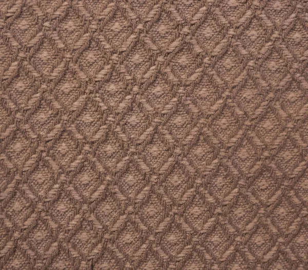 茶色の模様編み繊維ベッドカバー テクスチャの表面 — ストック写真