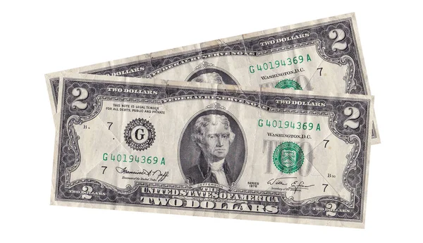 Dólares americanos rumores em um fundo branco — Fotografia de Stock