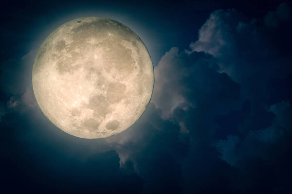 Surreal fantasy full moon on cloudy night sky