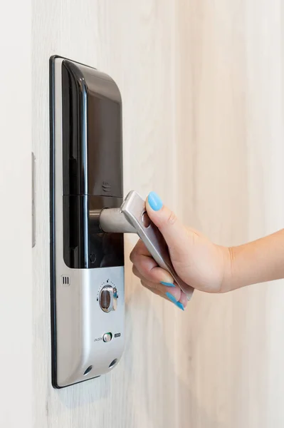 Woman open digital door lock from inside room