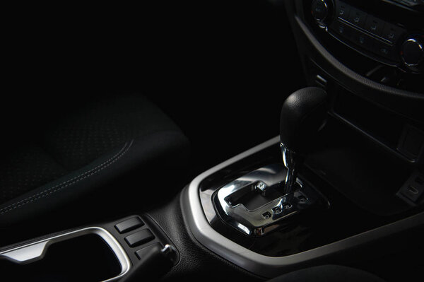 closeup automatic gear in new car with soft-focus and over light in the background