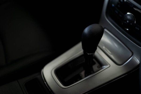 closeup automatic gear in new car with soft-focus and over light in the background